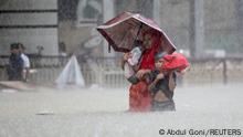 People wade through the water as they look for shelter during a flood, amidst heavy rains that caused widespread flooding in the northeastern part of the country, in Sylhet, Bangladesh, June 18, 2022. REUTERS/Abdul Goni NO RESALES. NO ARCHIVES
TPX IMAGES OF THE DAY 