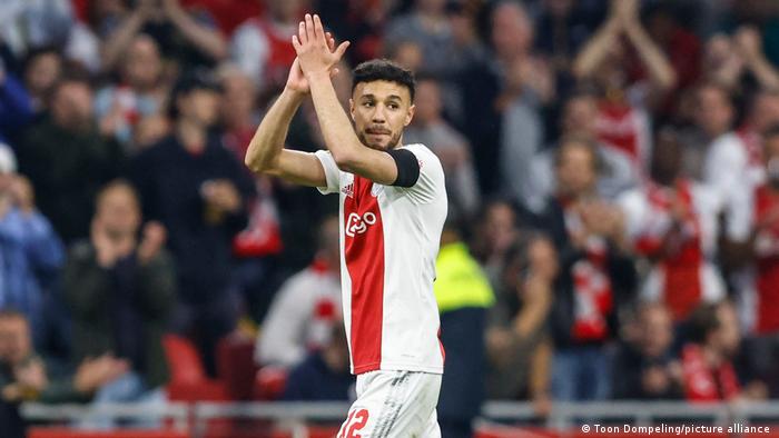 Noussair Mazraoui applauds Ajax fans during a Dutch league game