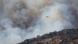 A helicopter flies next to a smoke during a wildfire near Artesa de Segre, Spain, June 18, 2022 A helicopter flies next to a smoke during a wildfire near Artesa de Segre, Spain, June 18, 2022