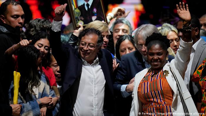 Gustavo Petro and Francia Marquez surrounded by supporters in Bogota