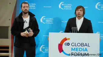 Mstyslav Chernov and Evgeniy Maloletka speak at the DW Freedom of Speech Award ceremony in 2022 in Bonn.