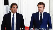 TOPSHOT - France's President Emmanuel Macron (R) walks next to France's right-wing Les Republicains (LR) party President Christian Jacob after a meeting as part of his talks with the opposition seeking to end the deadlock sparked by his failure to secure a majority in parliamentary elections at the Elysee Palace, in Paris, on June 21, 2022. - Macron hosted political party chiefs for rare talks at the Elysee as he seeks solutions to an unprecedented situation that risks plunging his second term into crisis two months after it began. (Photo by Mohammed BADRA / POOL / AFP) (Photo by MOHAMMED BADRA/POOL/AFP via Getty Images)