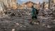In this June 17 photo, a local resident walks in a front of a building destroyed by a military strike, as Russia's attack on Ukraine continues, in Lysychansk In this June 17 photo, a local resident walks in a front of a building destroyed by a military strike, as Russia's attack on Ukraine continues, in Lysychansk
