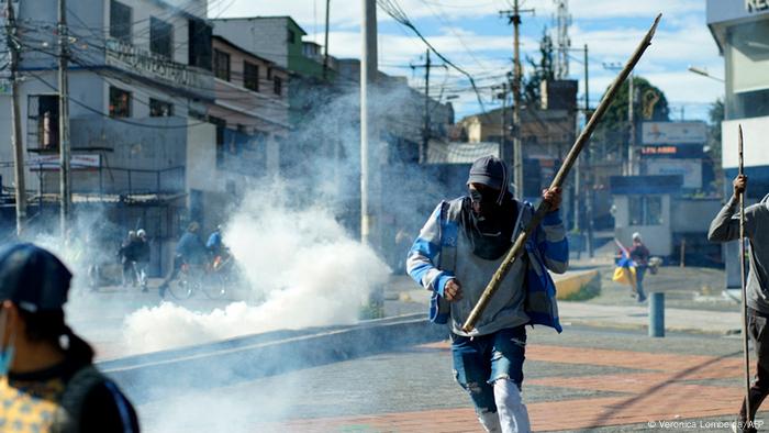 Demonstrators clash with police near El Arbolito park in Quito