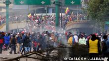 Hundreds of people take part in a protest near the House of Ecuadorean Culture in Quito, on June 21, 2022, on the ninth consecutive day of protests against the government. - Police used tear gas to disperse some 500 protesters, among thousands who arrived in Quito from around the country in recent days, during the Indigenous-led fuel price protests the military described as a grave threat. (Photo by Carlos Villalba / AFP)