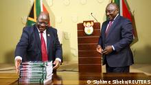 South Africa's President Cyril Ramaphosa receives the final investigation report from Chief Justice Raymond Zondo at the government's Union Buildings in Pretoria, South Africa, June 22, 2022. REUTERS/Siphiwe Sibeko