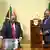 South Africa's Chief Justice Raymond Zondo hands the final investigation report to President Cyril Ramaphosa 