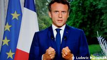A photo of a TV screen shows French President Emmanuel Macron speaking during televised address on June 22, 2022, in Paris. - President Emmanuel Macron made a televised address on June 22, his first public statement since his centrist party lost its parliamentary majority in elections. His address will come after meetings with the heads of most French political parties, including the far-right and far-left groupings that saw significant gains in parliament, potentially halting Macron's reformist agenda (Photo by Ludovic MARIN / AFP)