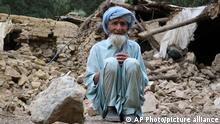 An Afghan man sits near his house that was destroyed in an earthquake in the Spera District of the southwestern part of Khost Province, Afghanistan, Wednesday, June 22, 2022. A powerful earthquake struck a rugged, mountainous region of eastern Afghanistan early Wednesday, killing at least 1,000 people and injuring 1,500 more in one of the country's deadliest quakes in decades, the state-run news agency reported. (AP Photo)