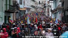 Anti-government protesters march to the presidential palace in Quito, Ecuador, Wednesday, June 22, 2022. Protests by Indigenous people demanding a variety of changes, including lower fuel prices, have paralyzed Ecuador's capital and other regions, but the government on Wednesday rejected their conditions for dialogue. (AP Photo/Dolores Ochoa)
