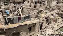 TOPSHOT - Damaged houses are pictured following an earthquake in Gayan district, Paktika province on June 22, 2022. - The 5.9-magnitude quake, which killed at least 1,000 people, struck hardest in the rugged east, where people already lead hardscrabble lives in the grip of a humanitarian crisis made worse since the Taliban takeover in August. (Photo by AFP) (Photo by -/AFP via Getty Images)