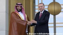 Turkish President Recep Tayyip Erdogan, right, and Saudi Crown Prince Mohammed bin Salman shake hands during a welcome ceremony, in Ankara, Turkey, Wednesday, June 22, 2022. Saudi Crown Prince arrived in Ankara on Wednesday, making his first visit to Turkey following the slaying of Saudi columnist Jamal Khashoggi in Istanbul. Saudi Arabia and Turkey press ahead with efforts to repair ties that were strained by Khashoggi's killing. (AP Photo/Burhan Ozbilici)