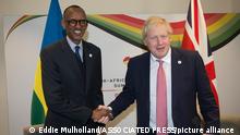 Britain's Prime Minister Boris Johnson, right, shakes hands with President of Rwanda Paul Kagame at the UK Africa Investment Summit in London, Monday Jan. 20, 2020. Boris Johnson is hosting 54 African heads of state or government in London. The move comes as the U.K. prepares for post-Brexit dealings with the world. (Eddie Mulholland/Pool via AP)