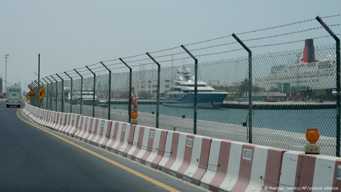 Madame Gu, a superyacht belonging to Russian oligarch Andrei Skoch, seen behind a fence at Dubai's Port Rashid