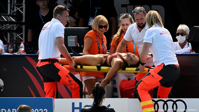 Anita Alvarez of United States is carried on stretcher after collapsing during the solo free final of the artistic swimming at the 19th FINA World Championships in Budapest, Hungary,