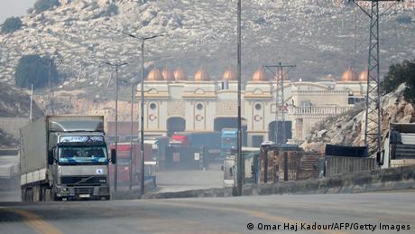  A convoy transporting humanitarian aid crosses into Syria from Turkey through the Bab al-Hawa border crossing.
