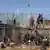 Des migrants sur les barrières à Melilla en 2022.
