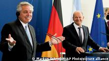 German Chancellor Olaf Scholz, right, and Argentina's President Alberto Fernandez brief the media after a meeting at the chancellery in Berlin, Germany, Wednesday, May 11, 2022. (AP Photo/Markus Schreiber)