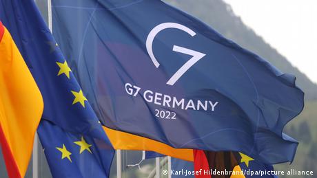 The flags of Germany, the EU and the 2022 G7 summit flutter in the breeze