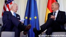 German Chancellor Olaf Scholz and U.S. President Joe Biden talk during a bilateral meeting ahead of the G7 leaders summit at Bavaria's Schloss Elmau castle, near Garmisch-Partenkirchen, Germany, June 26, 2022. REUTERS/Jonathan Ernst