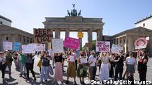 BERLIN, GERMANY - MAY 08: Activists demonstrate in front of the Brandenburg Gate for the right to an abortion on May 08, 2022 in Berlin, Germany. The recent leak of the U.S. Supreme Court's possible intent to void Roe vs. Wade has caused an uproar for abortion and pro-life activists alike. In Germany abortion is technically still illegal though possible under specific conditions. (Photo by Sean Gallup/Getty Images)