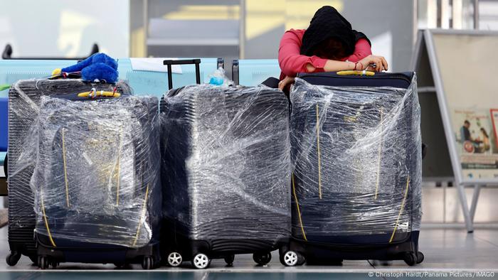 Travelers with their luggage