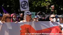 Protesters take part in an anti NATO demonstration march ahead of the 2022 NATO Summit in Madrid, Spain, Sunday, June 26, 2022. (AP Photo/Paul White)