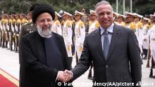 TEHRAN, IRAN - JUNE 26: (----EDITORIAL USE ONLY Äì MANDATORY CREDIT - IRANIAN PRESIDENCY / HANDOUT - NO MARKETING NO ADVERTISING CAMPAIGNS - DISTRIBUTED AS A SERVICE TO CLIENTS----) Iraqi Prime Minister Mustafa Al-Kadhimi (R) being welcomed by Iranian President Ebrahim Raisi (L) with an official ceremony at Sa'dabad Palace, in Tehran, Iran on June 26, 2026. Iranian Presidency / Handout / Anadolu Agency