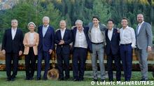 (L-R) Italian Prime Minister Mario Draghi, President of the European Commission Ursula von der Leyen, US President Joe Biden, German Chancellor Olaf Scholz, British Prime Minister Boris Johnson, Canadian Prime Minister Justin Trudeau, Japanese Prime Minister Fumio Kishida, French President Emmanuel Macron and President of the European Council Charles Michel pose for an informal group photo sitting on a bench after a working dinner during the G7 Summit held at Elmau Castle, southern Germany on June 26, 2022. Markus Schreiber /Pool via REUTERS
