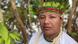 Adriano Karipuno, law student, Amazon, wears a headdress and looks into the camera Adriano Karipuno, law student, Amazon, wears a headdress and looks into the camera