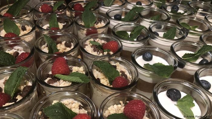 A closeup of a table filled with desserts