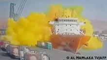 This image grab taken from a CCTV footage broadcasted by Jordan's Al-Mamlaka TV on June 27, 2022 shows the moment of a toxic gas explosion in Jordan's Aqaba port. - Footage on state TV showed a large cylinder plunging from a crane on a moored vessel, causing a violent explosion of yellow gas. The government spokesman urged citizens not to approach the site of the accident, adding that medical reinforcements were being sent to Aqaba. (Photo by various sources / AFP) / RESTRICTED TO EDITORIAL USE - MANDATORY CREDIT AFP PHOTO /AL MAMLAKA TV - NO MARKETING - NO ADVERTISING CAMPAIGNS - DISTRIBUTED AS A SERVICE TO CLIENTS