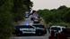 Law enforcement officers work at the scene where people were found dead inside a trailer truck in San Antonio, Texas Law enforcement officers work at the scene where people were found dead inside a trailer truck in San Antonio, Texas