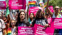 June 26, 2022, New York City, New York, United States: A woman with a t-shirt saying ''1973'' and a sign saying ''Protect safe, legal abortion - Planned Parenthood'' and other people holding signs saying ''I stand with Planned Parenthood'' marching with the Planned Parenthood group at the New York City Pride March. (Credit Image: Â© Michael Brochstein/ZUMA Press Wire
