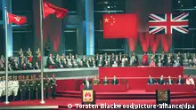 Chinese President Jiang Zemin addresses delegates following the raising of the Chinese and Hong Kong SAR flags. Hong Kong returned to Chinese rule after more than 156 years as a British possession. dpa - COLORplus -