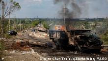 May 28, 2022, Lysychansk, Luhanska Oblast, Ukraine: A truck can be seen destroyed and on fire at the bridge connecting Severodoonetsk and Lysychansk, Luhansk. As Russian troops launching the offensive from multiple directions, hoping to cut off Ukrainian supplies and reinforcements and gain full control of the Luhansk Oblast, the town of Lysychansk connecting Severodoonetsk is heavily bombarded and sieged. Lysychansk Ukraine - ZUMAs197 20220528_zaa_s197_464 Copyright: xAlexxChanxTszxYukx 