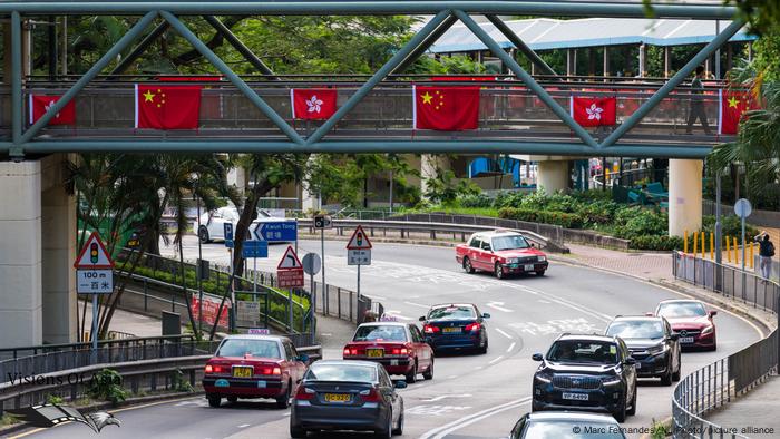 China and Hong Kong flags decorate a highway bridge in Hong Kong