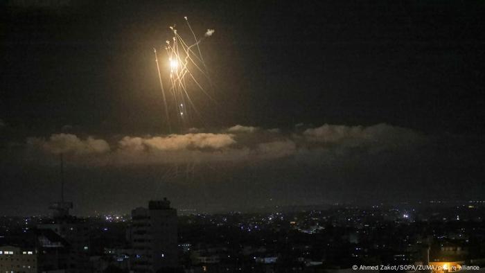 Streaks of light are seen as Israel's Iron Dome anti-missile system intercepts rockets launched from the Gaza Strip towards Israel.