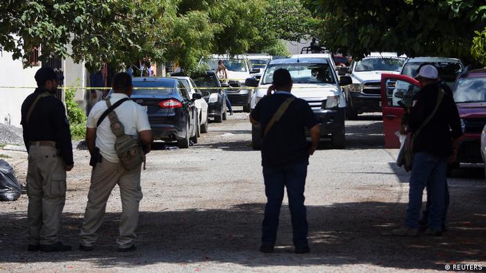 Police officers guard a scene where journalist Antonio de la Cruz was killed by unknown assailants while leaving his home, in Ciudad Victoria, Mexico