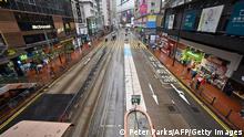 21.02.2022 *** TOPSHOT - A usually busy street in Hong Kong's Causeway Bay district is seen empty on February 21, 2022, as the city faces its worst Covid-19 coronavirus wave to date. (Photo by Peter PARKS / AFP) (Photo by PETER PARKS/AFP via Getty Images)
