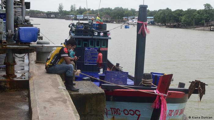 A trawler flying a Myanmar flag docks at Ranong's public jetty after unloading its haul
