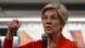 US Senator Elizabeth Warren holding a microphone addressing a crowd during a town hall meeting
