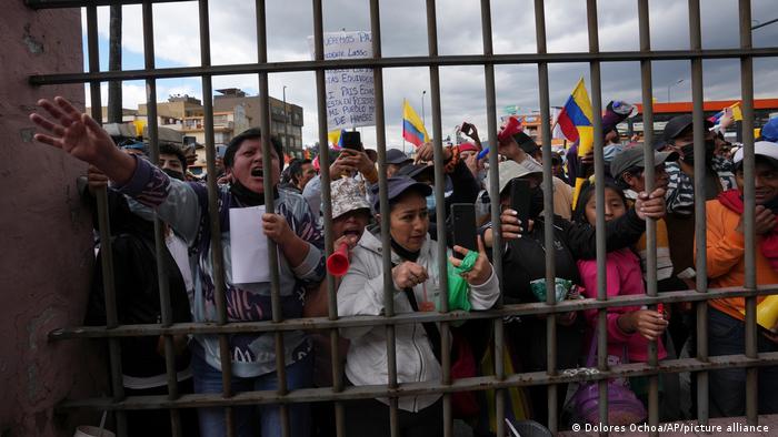 Indigenous protesters gather outside the Episcopal Conference headquarters where Indigenous leaders dialogue with the government in Quito, Ecuador, Thursday, June 30, 2022.