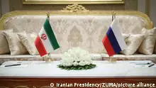 June 30, 2022, ASHGABAT, ASHGABAT, TURKMENISTAN: Iran (L) and Russia (R) flags are seen during a meeting between Russian President VLADIMIR PUTIN and Iran's President EBRAHIM RAISI on the sidelines of the 6th Caspian littoral states Summit in Ashgabat, Turkmenistan on June 29, 2022. President of Azerbaijan Ilham Aliyev, President of Iran Ebrahim Raisi, Russian President Vladimir Putin, and President of Kazakhstan Kassym-Jomart Tokayev are taking part in the summit at the invitation of Turkmen leader Serdar Berdimuhamedov. One of the main issues of the 6th Caspian Summit is the organization of a transport corridor through the Caspian Sea. The Trans-Caspian route is the most optimal and fastest, and capable of becoming very active in terms of Russian exports to India, Pakistan, Indonesia, Malaysia, and also the Persian Gulf states. In the opposite direction, it will work for Russia to receive various imported goods. (Credit Image: Â© Iranian Presidency via ZUMA Press Wire