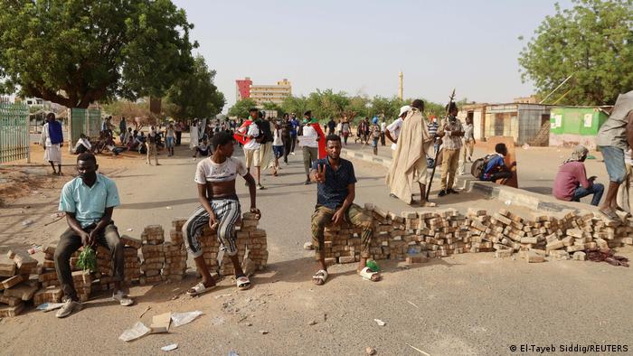 Protesters sit on barricades in Khartoum
