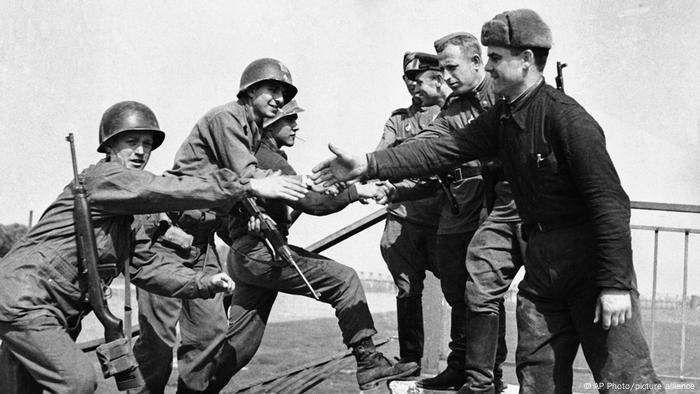 US and Russian forces meet on wrecked bridge over Elbe River in Torgau