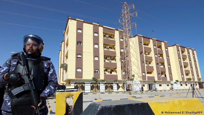 Libyan security forces stand guard outside the entrance to the conference center in the eastern coastal city of Tobruk, the building used as the parliament. Archive image from March 2021.