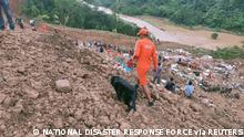 Members of rescue teams search for survivors after a landslide in Noney in the northeastern state of Manipur, India, June 30, 2022. National Disaster Response Force/Handout via REUTERS THIS IMAGE HAS BEEN SUPPLIED BY A THIRD PARTY. NO RESALES. NO ARCHIVES.