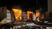 This picture taken early on July 2, 2022 shows a fire inside the building used by Libya's Tobruk-based parliament building in the country's east, lit up by protesters who broke inside while demonstrating against deteriorating living conditions and political deadlock. - Libya's parliament, or House of Representatives, has been based in Tobruk, hundreds of kilometres (miles) east of the capital Tripoli, since an east-west schism in 2014 following the revolt that toppled dictator Moamer Kadhafi three years earlier. A rival body, formally known as the High Council of State, is based in Tripoli. Images on July 1 showed that a protester driving a bulldozer had managed to smash through part of a gate, allowing other demonstrators to enter more easily, while cars of officials were set on fire. (Photo by AFP)