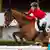 Springreiterin Janne Fiederike Meyer-Zimmermann bei einem Sprung auf ihrem Pferd Messi